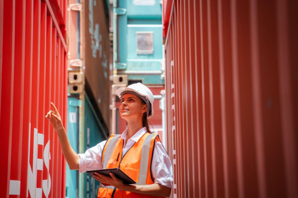 International shipping logistics,Logistics workers of forwarder with tablet inspect cargo.